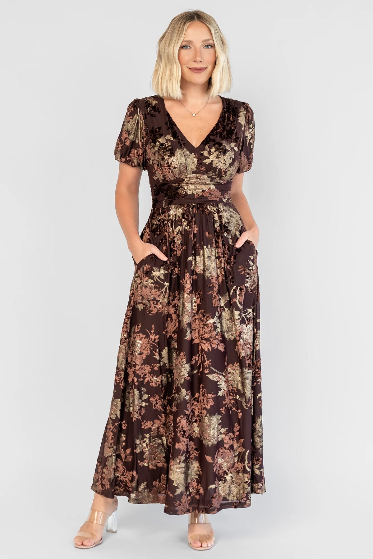 Leslie Velvet Maxi Dress in Brown + Metallic Gold with an embossed velvet floral design, a V-neckline, and puff sleeves.