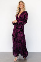 Back and three-quarter view of mulberry embossed velvet maxi dress showing elasticized back waist and overall silhouette.