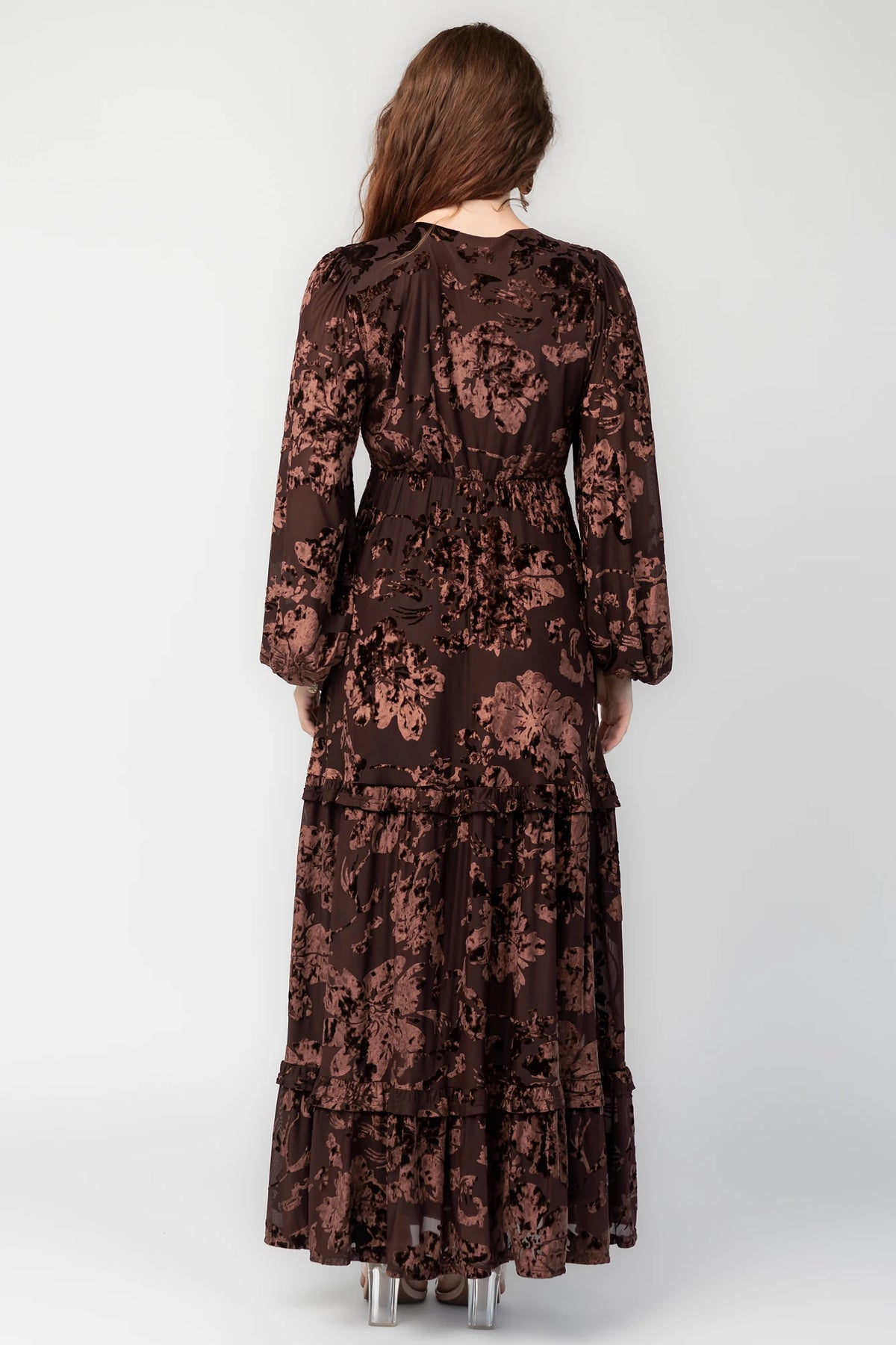 Liana Velvet Embossed Ruffle-Tier Maxi Dress in Brown with V-neck, long sleeves, elastic waist, and tiered skirt.