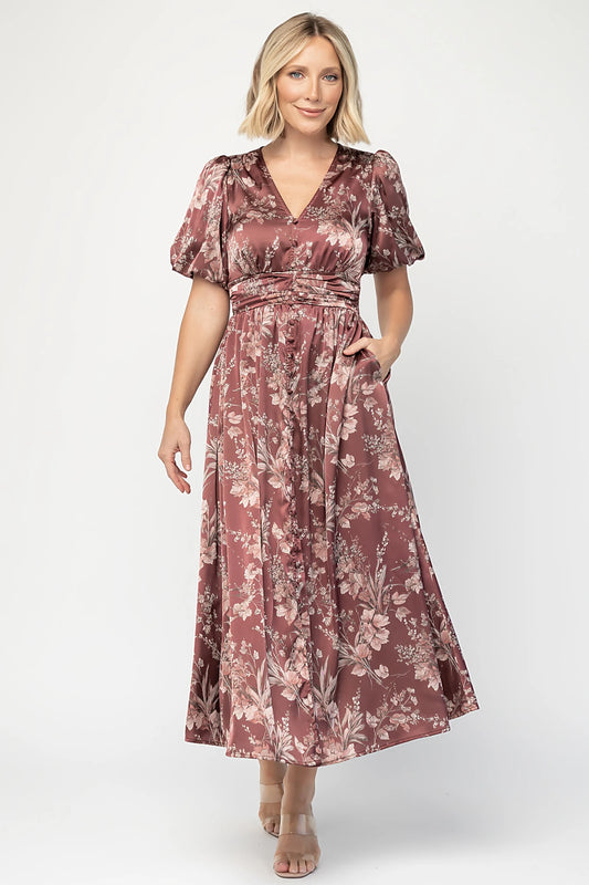 Lilibet Satin Dress in Clove Floral with V-neckline, short sleeves, faux front buttons, gathered waist, and satin finish.