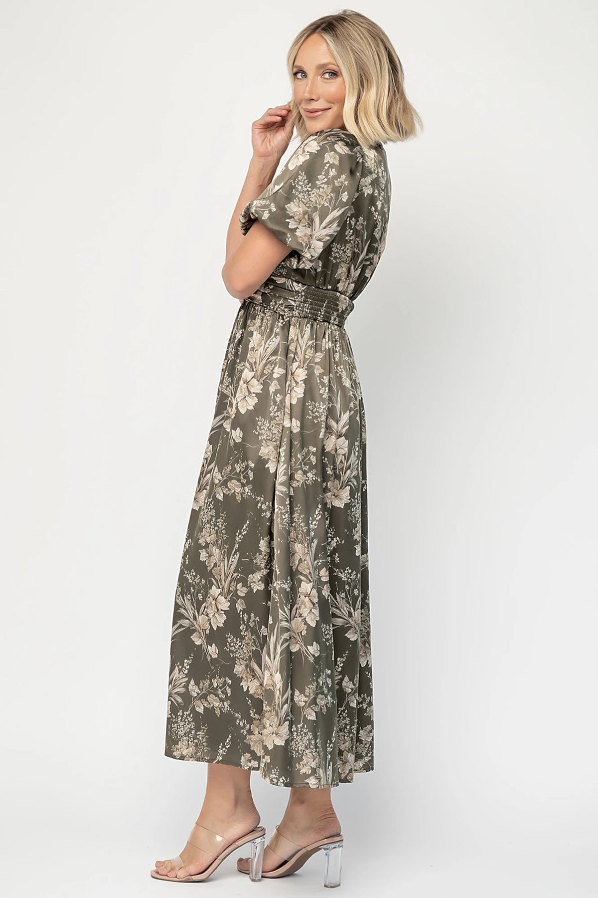 Lilibet Satin Dress in Olive Floral with V-neckline, short sleeves, faux front buttons, gathered waist, and satin finish.