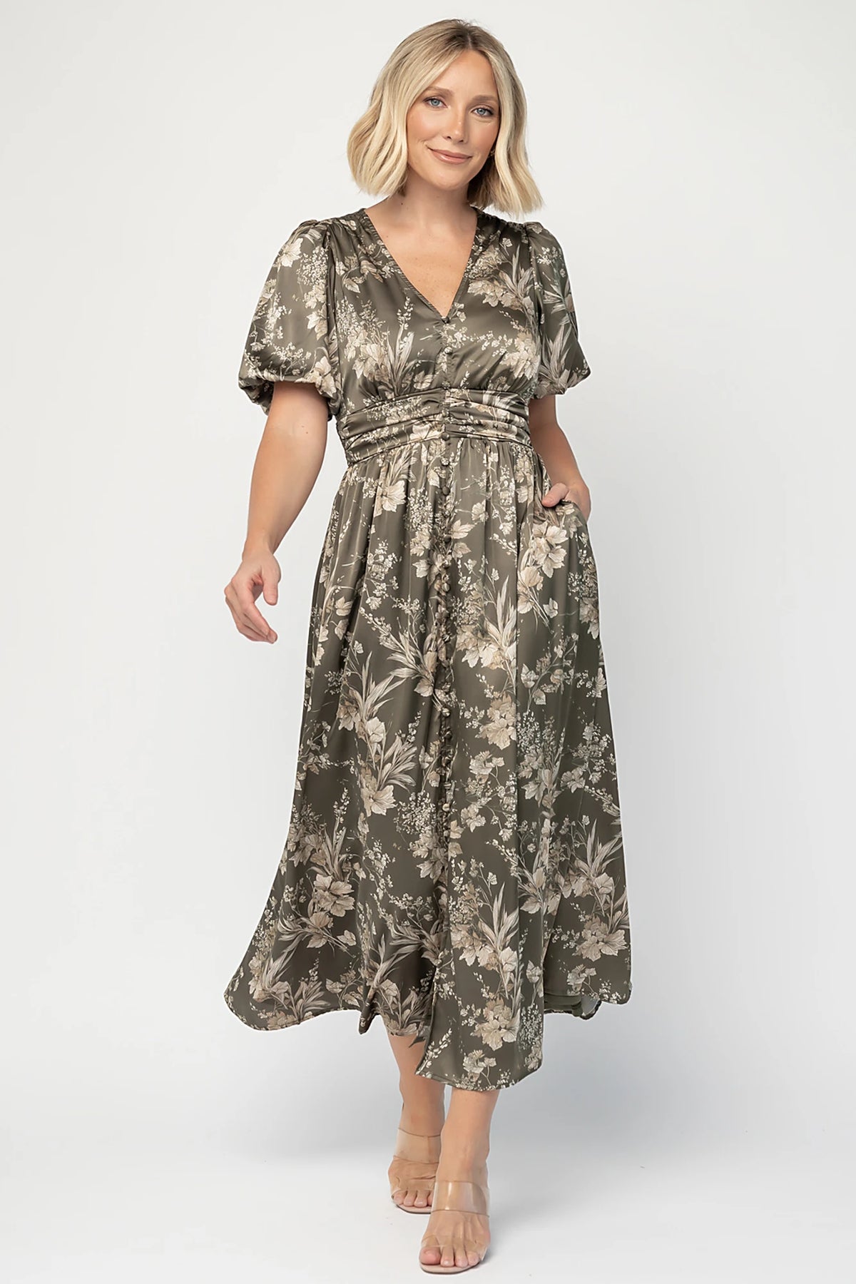 Lilibet Satin Dress in Olive Floral with V-neckline, short sleeves, faux front buttons, gathered waist, and satin finish.