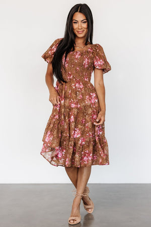 Front view of Lizzy smocked midi dress in copper and pink floral chiffon, showing square smocked neckline, smocked bodice, and tiered overlay skirt.