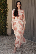 Back view of Luciana maxi dress showing keyhole with double-button closure, smocked collar, and the elasticized back for a comfortable fit.