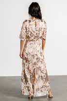 Flat-lay product image of Lucy Sequin Dress in rose gold showing overall silhouette, raw-hem skirt, and sequin pattern.