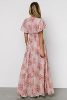 Detail shot of smocked waist and interior lining of the Lynlee Metallic Maxi Dress in Pink Multi, highlighting skirt fullness and 100% polyester composition.