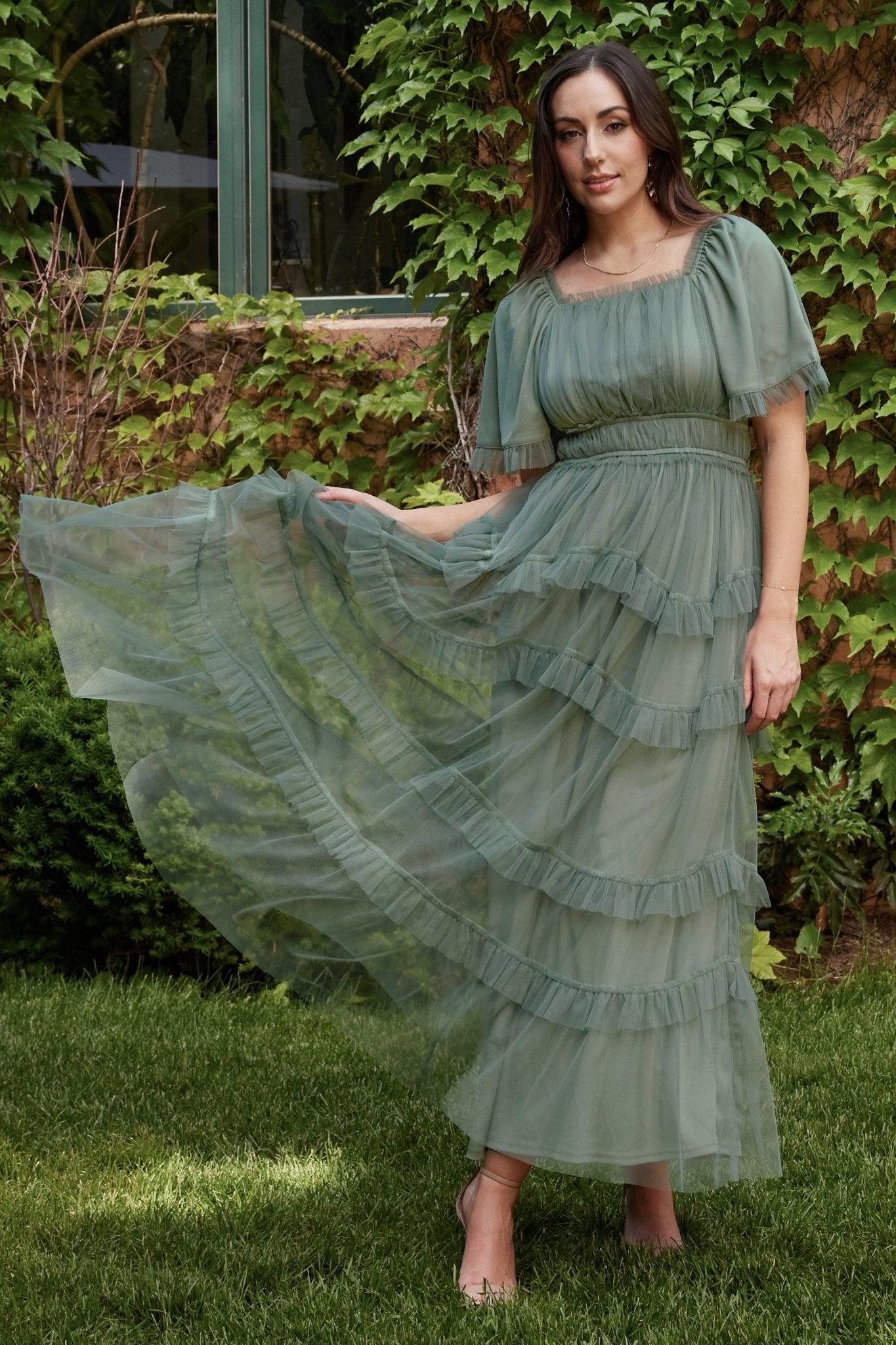 Close-up of the Magdalena dress in eucalyptus, focusing on ruffle trim at the square neckline and delicate tulle texture.