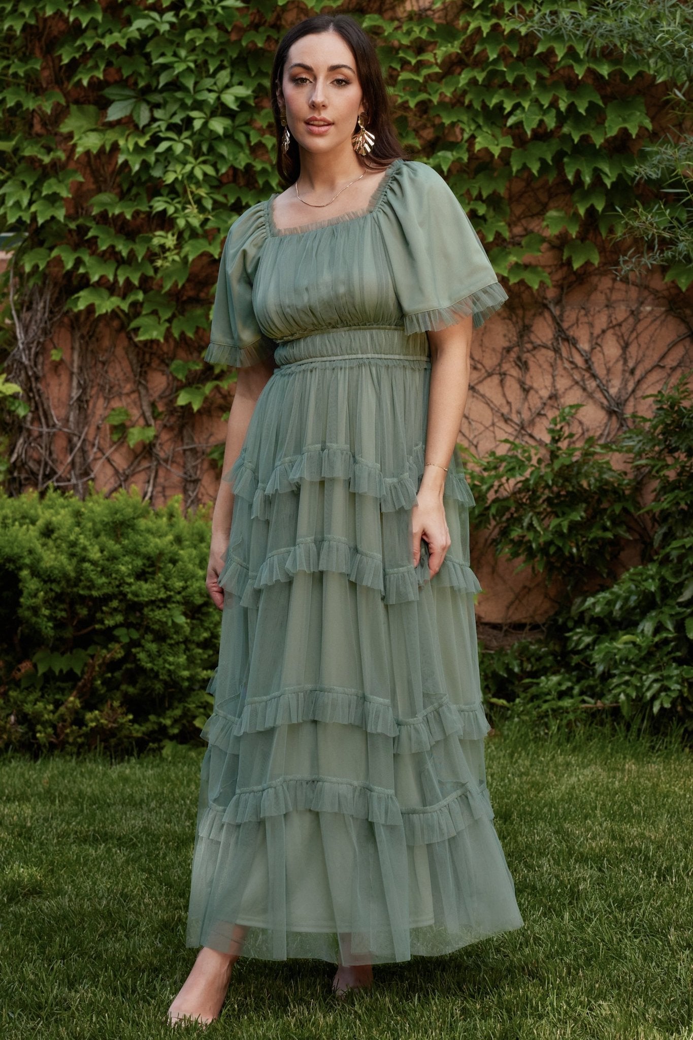 Studio shot of the Magdalena Tulle Maxi Dress in eucalyptus, showing layered tulle overlay and soft tiered ruffles.