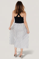 Close-up of Marbella Tank Dress fabric showing navy, gray, and off-white stripes and contrast between ribbed bodice and cotton-blend skirt.