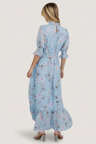 Pleated front waist and elasticized back waist detail on the sky-blue floral chiffon maxi, illustrating fit, shaping, and gathering.