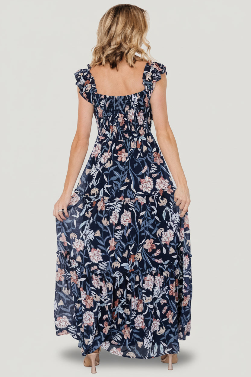 Three-tiered skirt detail on Martina Maxi Dress in navy multi floral chiffon, showing small ruffles and soft drape.