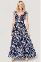 Back view of Martina Maxi Dress in navy multi, showing smocked back bodice, flow of the skirt, and overall silhouette.