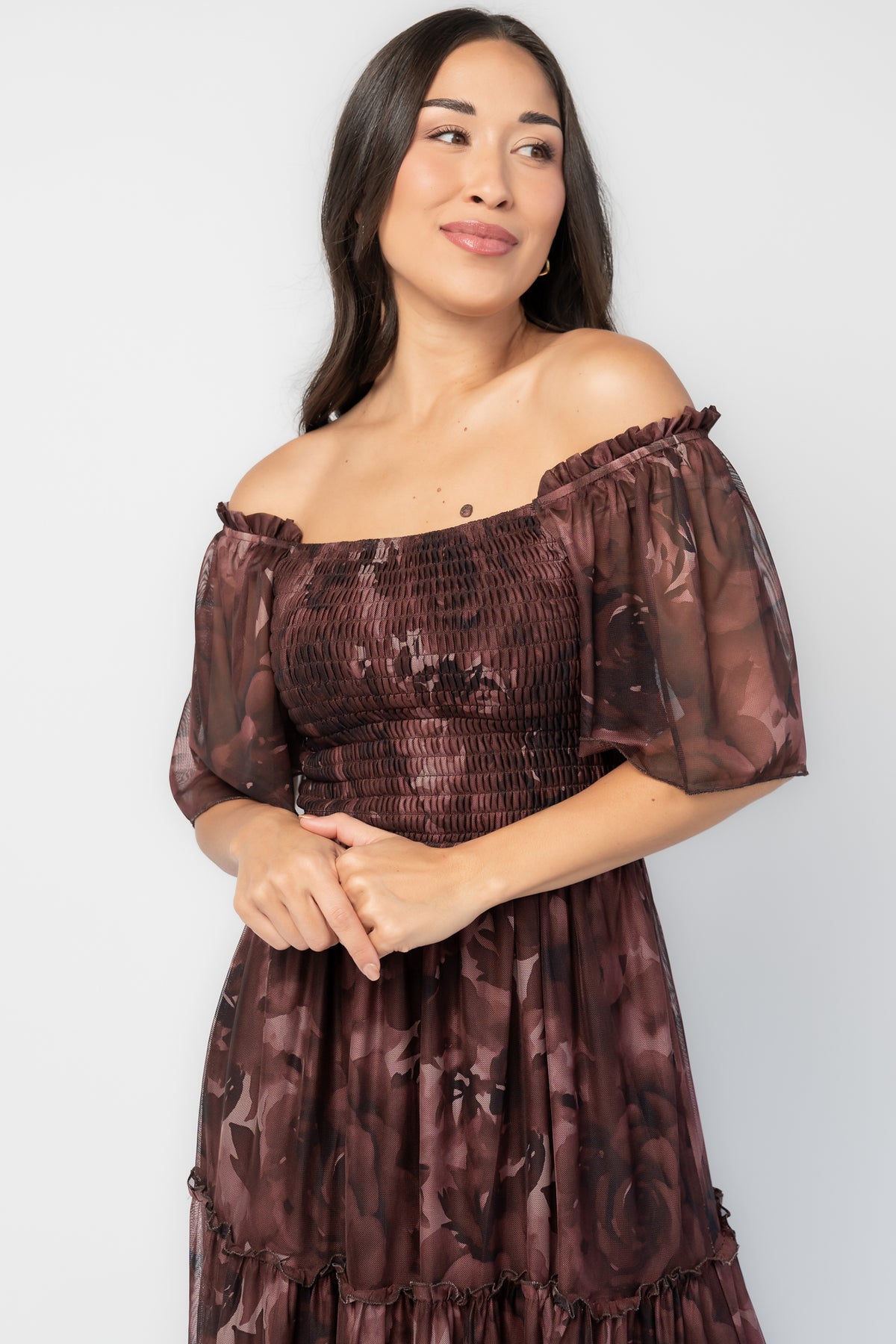 Meya Mesh Maxi Dress in Dark Mahogany Print with abstract florals, smocked bodice, flutter sleeves, and tiered skirt.