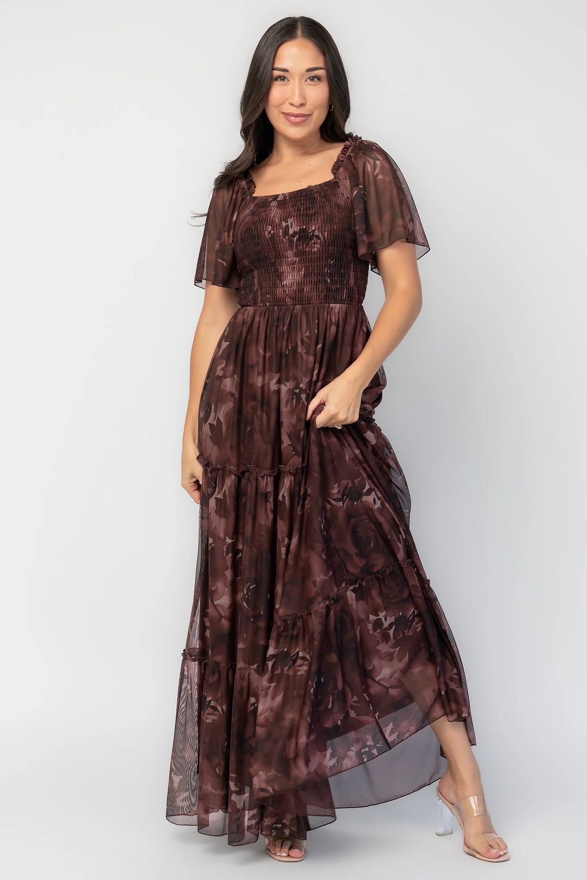 Meya Mesh Maxi Dress in Dark Mahogany Print with abstract florals, smocked bodice, flutter sleeves, and tiered skirt.