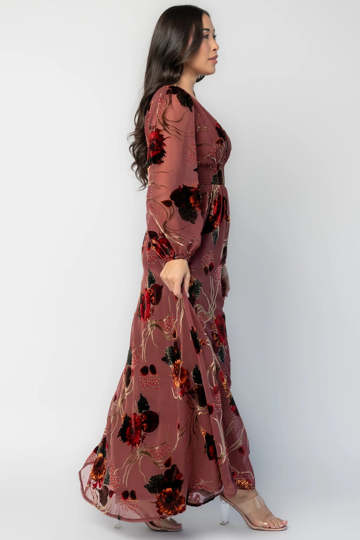 Mikla Maxi Dress in Berry Multi with burnout velvet print, deep V-neckline, long sleeves, smocked waist, and asymmetrical hem.