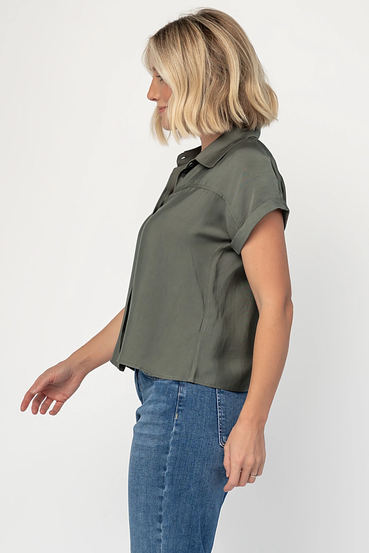 Miriam Top in Dark Sage with collared neckline, concealed button front, cuffed short sleeves, and relaxed silhouette.