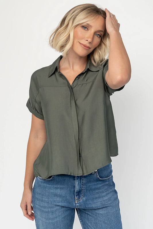 Miriam Top in Dark Sage with collared neckline, concealed button front, cuffed short sleeves, and relaxed silhouette.