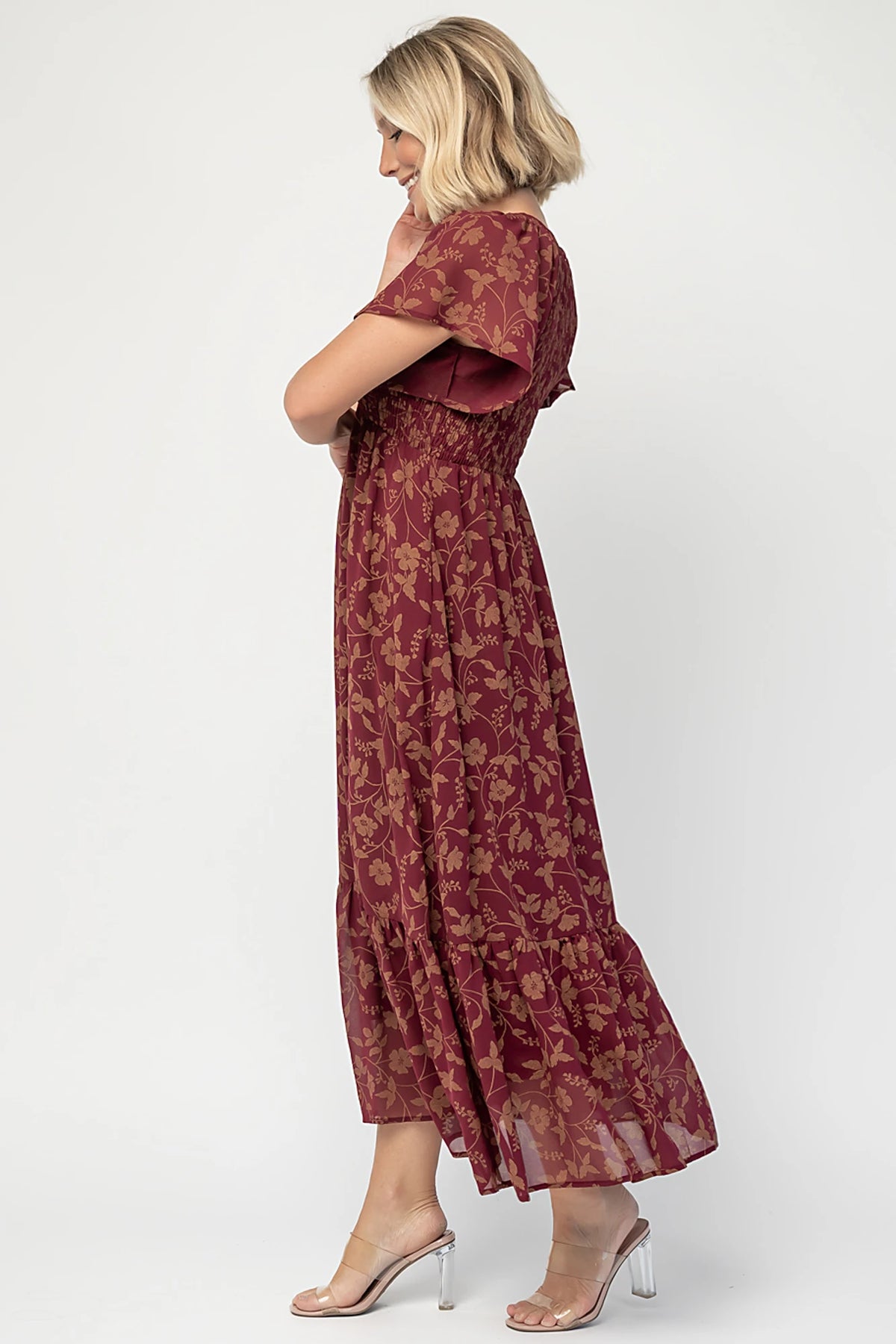 Monica Smocked Dress in Wine + Gold with V-neckline, smocked bodice, flutter sleeves, high waist, and tiered skirt.