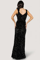 Side view of Monroe sequin gown emphasizing the left-side leg slit, elastic waistband and the way the gown moves with each step.