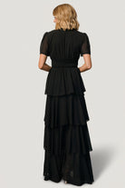Hem and tier detail of the Montaigne maxi dress highlighting the asymmetrical ruffles and the fullness of the maxi skirt.