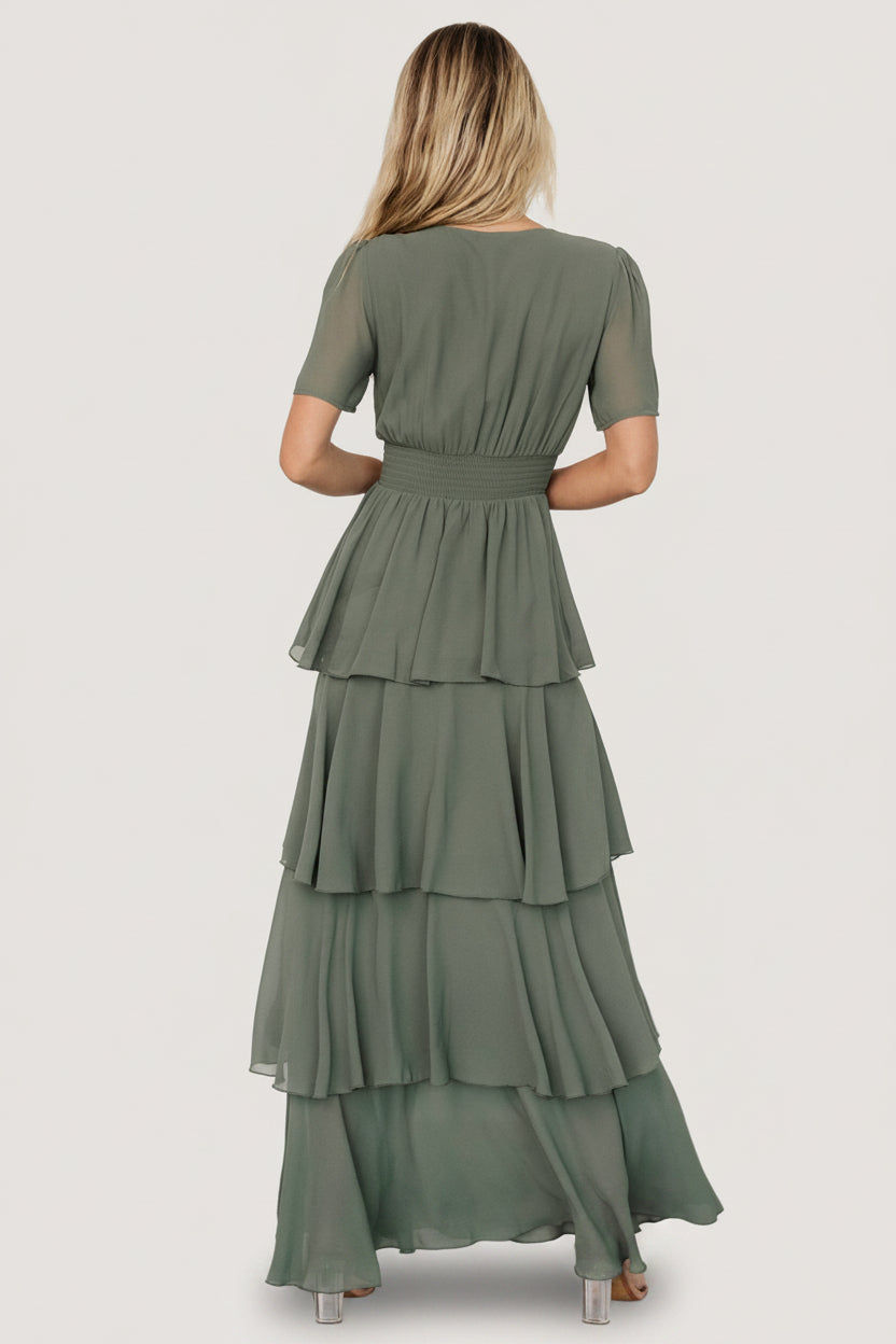 Three-quarter view of the Montaigne Ruffle Maxi Dress in Dark Sage illustrating the layered skirt, ruffle cascade and flattering silhouette in lightweight chiffon.
