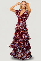 Close-up of v-neckline and smocked back of the mulberry floral dress, highlighting contouring panel and chiffon texture with floral print.