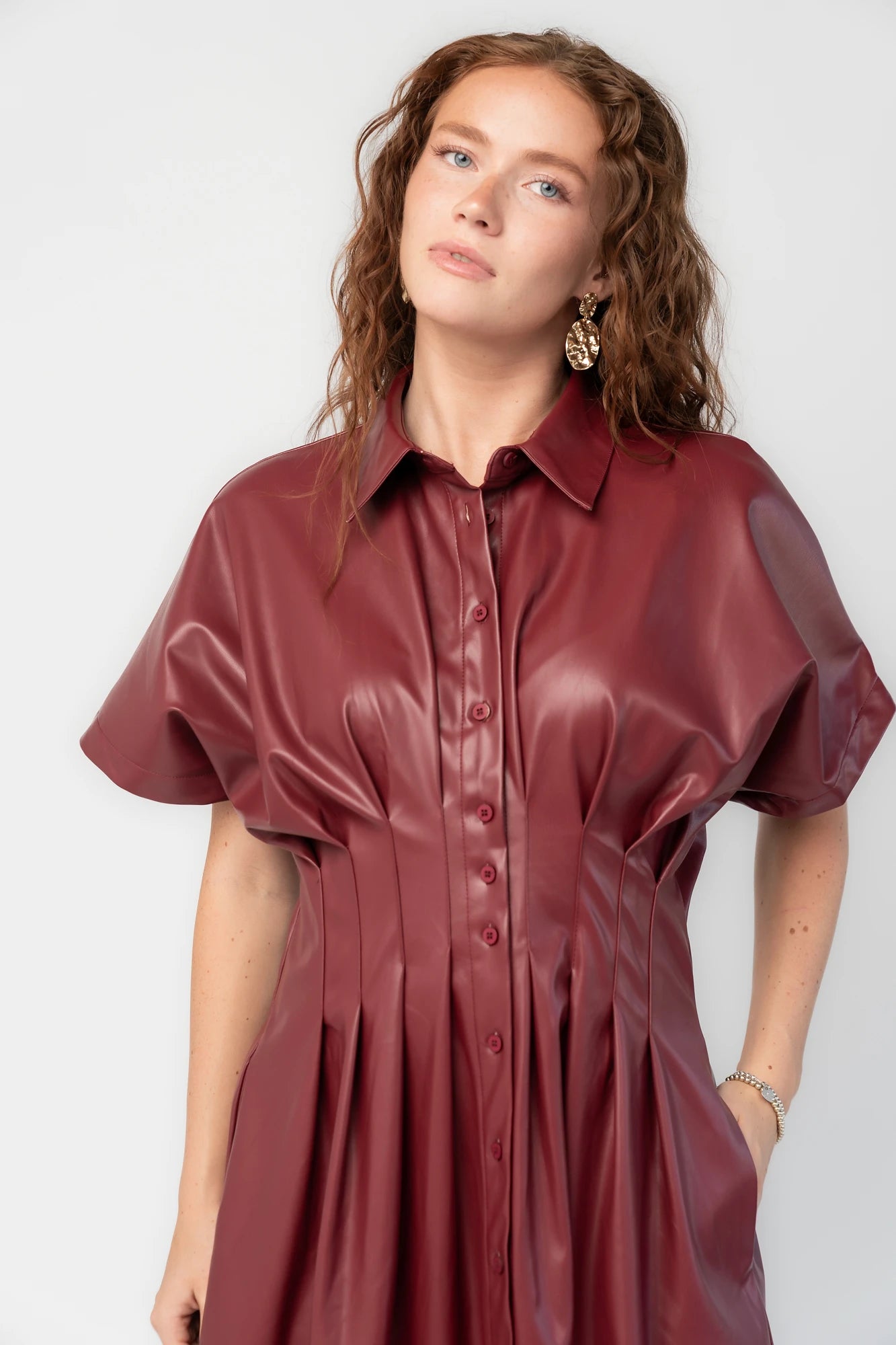 Montclair Structured Midi Shirt Dress in Burgundy with faux leather, button front, pleated waist, and full skirt.