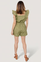 Detail shot of pocket and seam construction on olive denim-look romper, illustrating functional front pocket and finish.