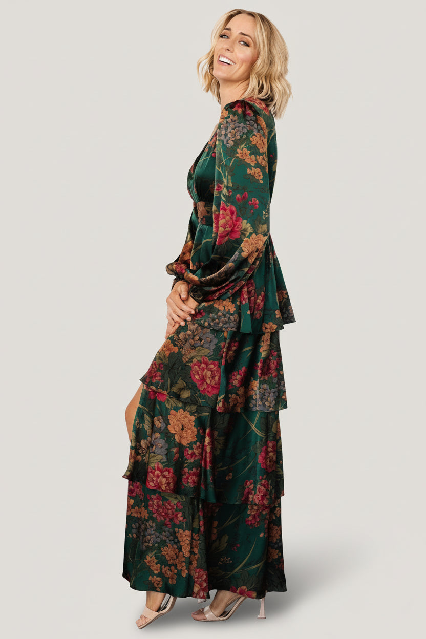 Styled outfit view: model wearing emerald floral satin maxi dress with minimal accessories to show overall length and movement.