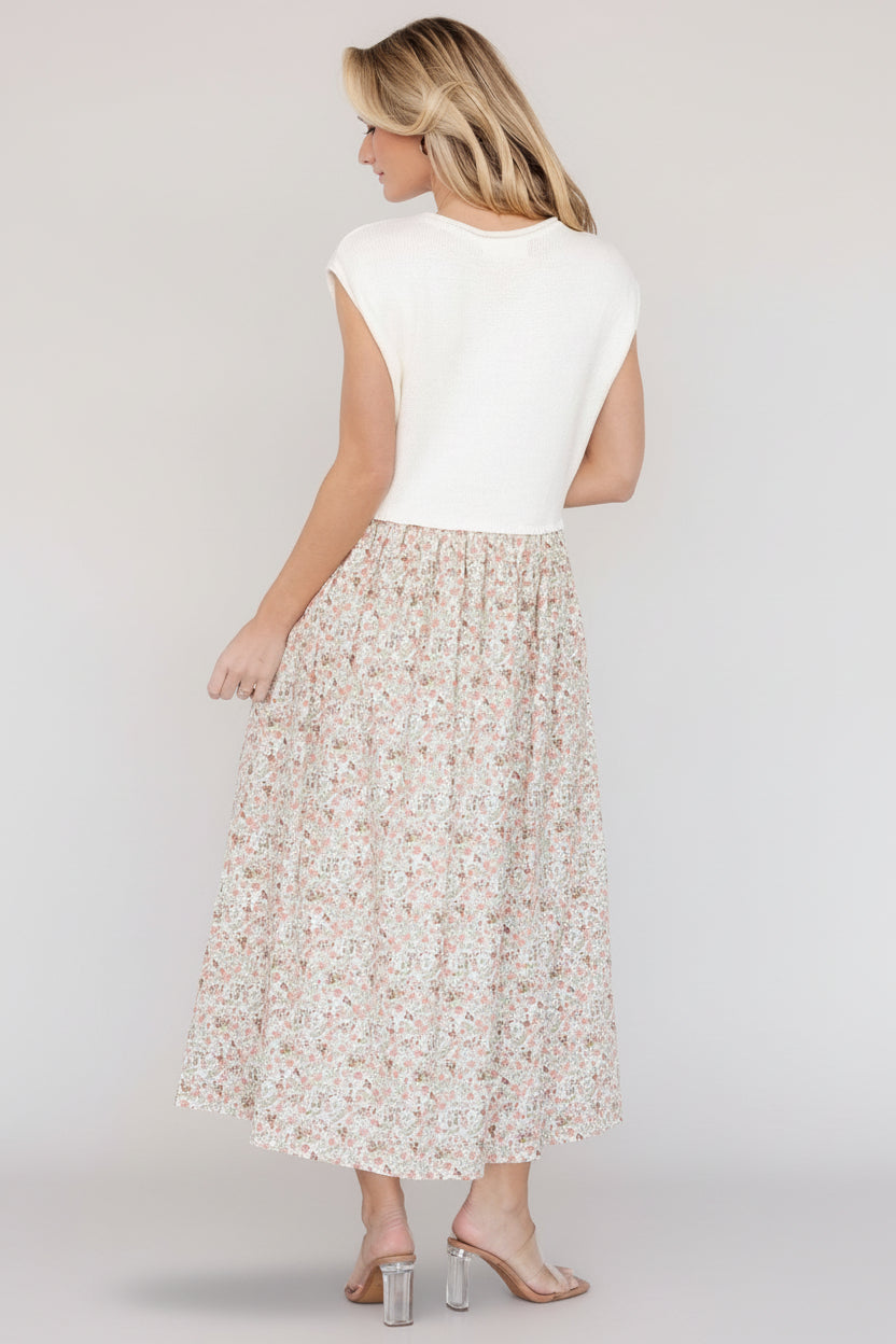 Back view of Myra sweater dress showing midi length and balanced proportions between bodice and skirt.