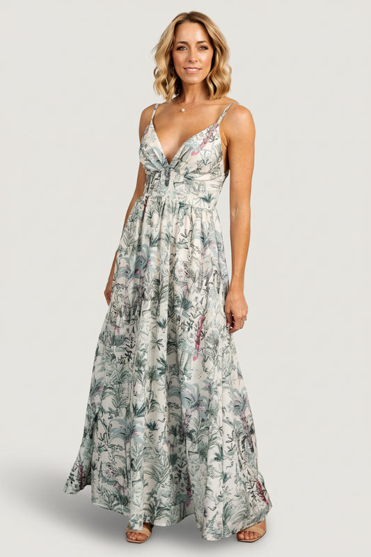 Front view of Naia Maxi Dress in natural background with sage, pink and lavender tropical print, showing deep V-neck and gathered bust.