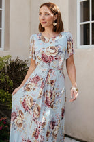 Close-up of Naomi dress sleeve and shoulder showing short flutter sleeve silhouette and delicate chiffon drape.