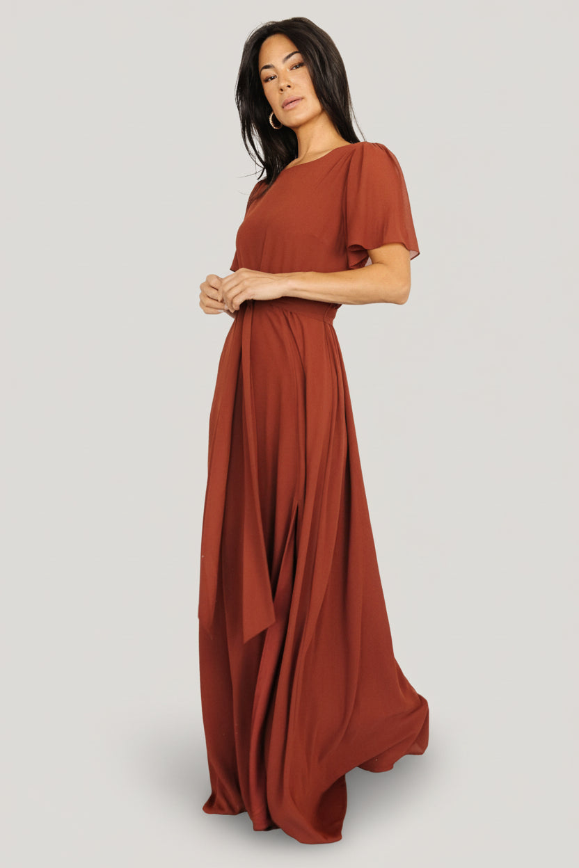 Close-up of Naomi cinnamon chiffon fabric and short flutter sleeve showing texture and lightweight weave.