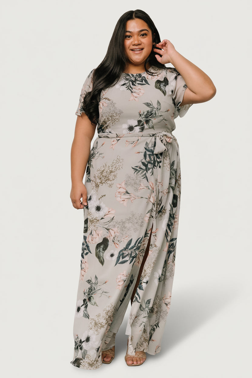 Back view of Naomi maxi dress showing keyhole back with button closure and elasticized back waist for an adjustable fit on the model.