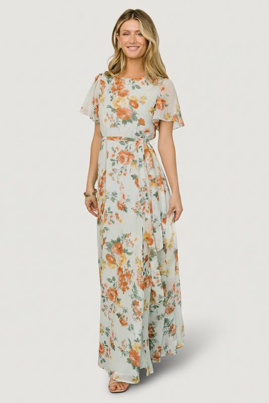 Front view of sage floral chiffon maxi dress with rounded neckline, short flutter sleeves, removable waist tie, and flowing hem for movement.
