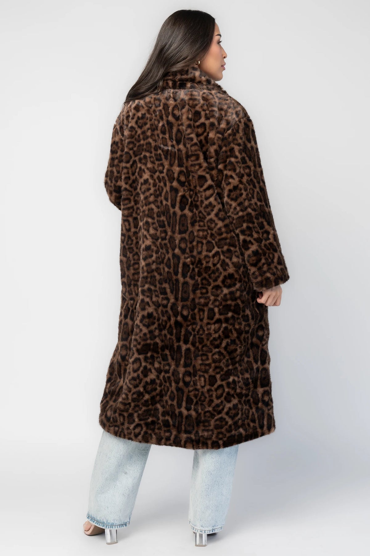 Novalie Coat in Brown Leopard Print with plush faux fur texture, notched collar, long sleeves, and longline silhouette.