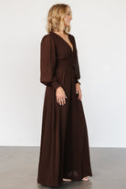 Detail shot of Olivia dress sleeve with smocked cuff and sheer chiffon fabric in deep espresso brown.