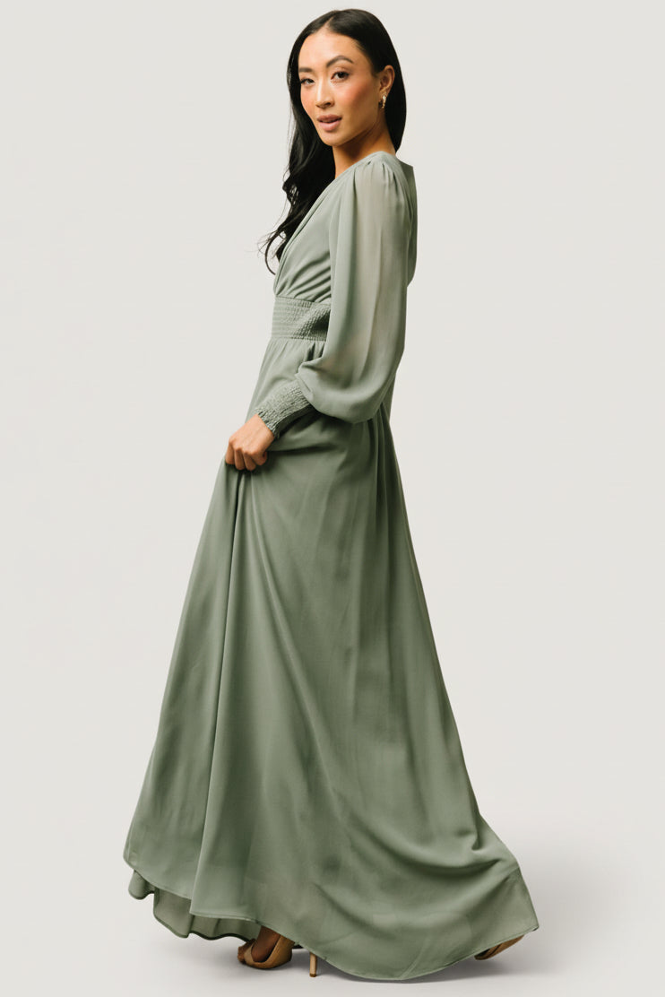 Close-up of smocked waist and flattering gather on the Olivia Maxi dress in eucalyptus, highlighting texture and fit detail.