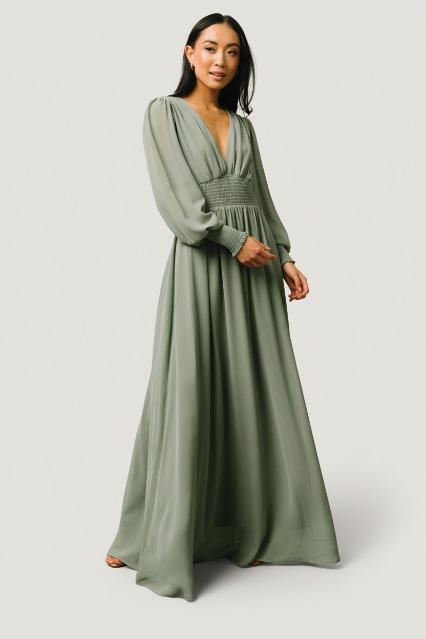 Model catalog image of Olivia Maxi dress in eucalyptus highlighting neckline, smocked waist, and overall maxi length on a size S model.