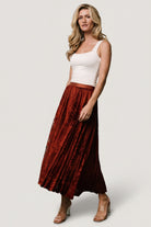 Detail image highlighting the Palini skirt's burn-out velvet texture, lining edge, and soft mesh overlay.