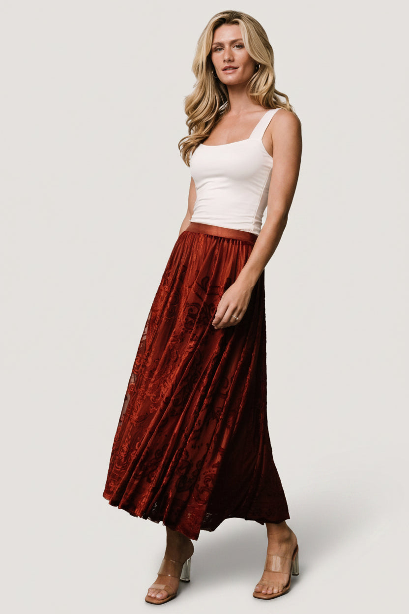 Detail image highlighting the Palini skirt's burn-out velvet texture, lining edge, and soft mesh overlay.