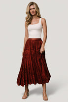 Back view of the Palini rust velvet burnout midi skirt, fully lined with a gentle A-line shape.