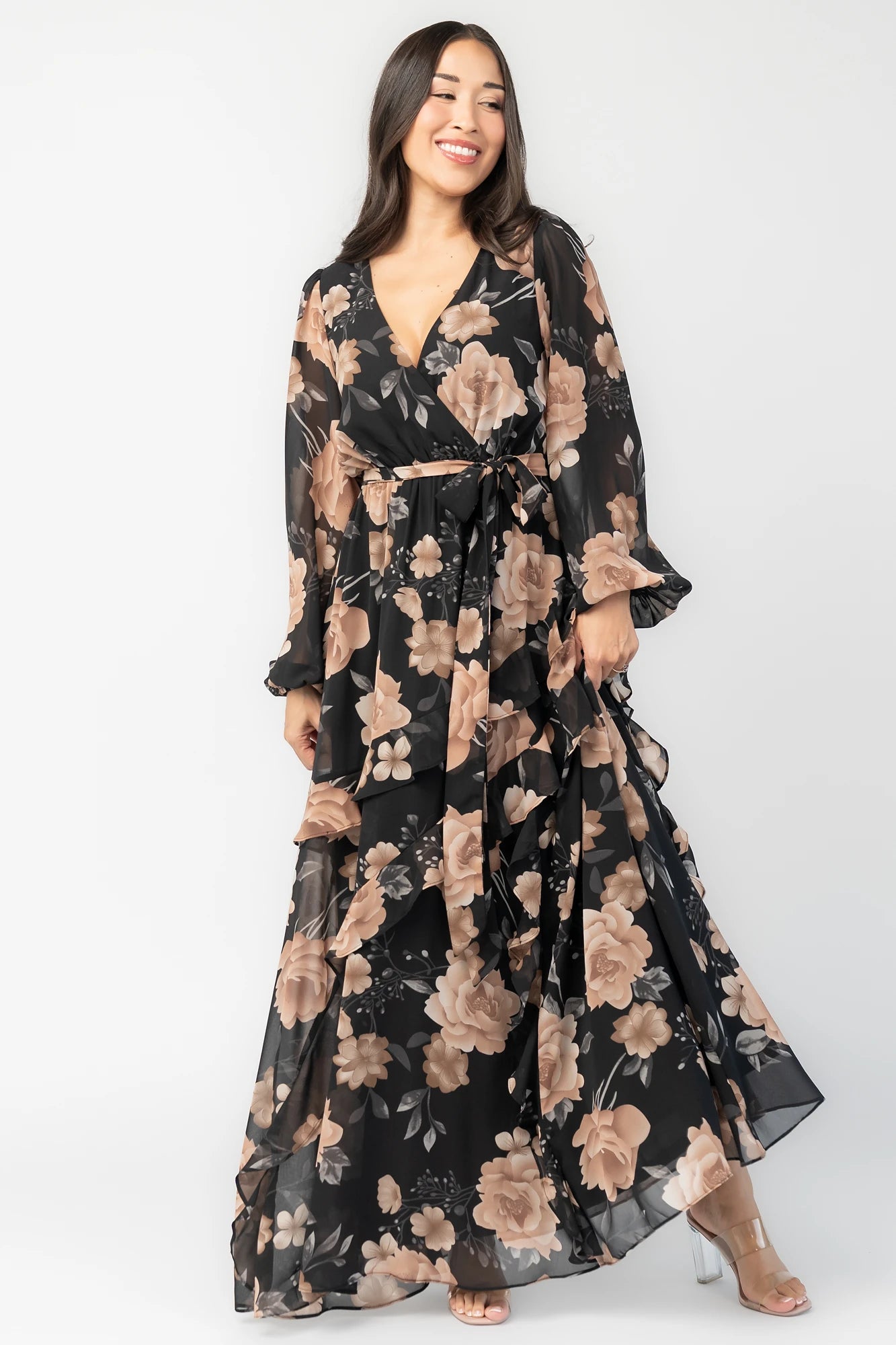 Phaedra Maxi Dress in Black + Taupe Floral with surplice V-neck, long sleeves, sash waist, and tiered skirt.