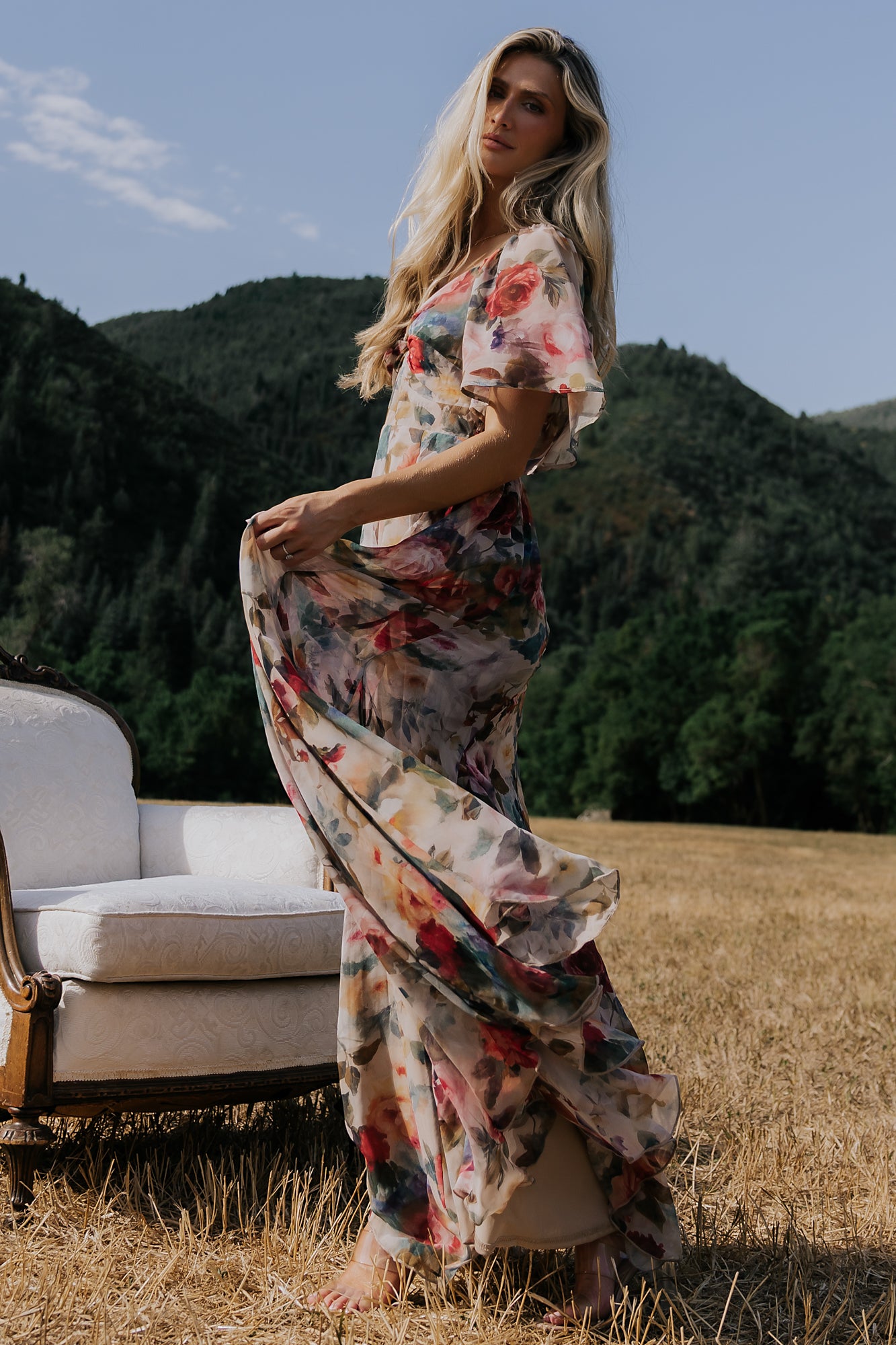 Positano Maxi Dress in Rose Multi Floral with sweetheart knot neckline and flutter sleeves.