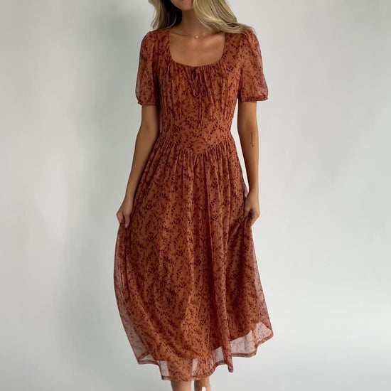 Spice floral mesh midi dress with a square neckline, short puff sleeves, fitted bodice, waist panel, and flowing midi skirt.
