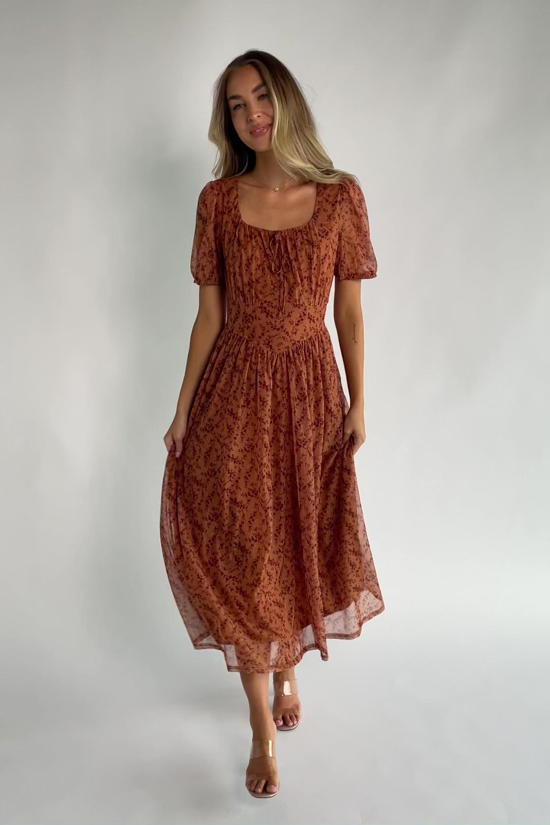 Spice floral mesh midi dress with a square neckline, short puff sleeves, fitted bodice, waist panel, and flowing midi skirt.
