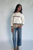 Natural color-block sweater with horizontal tan and brown stripes, a round neckline, long sleeves, and a relaxed fit.