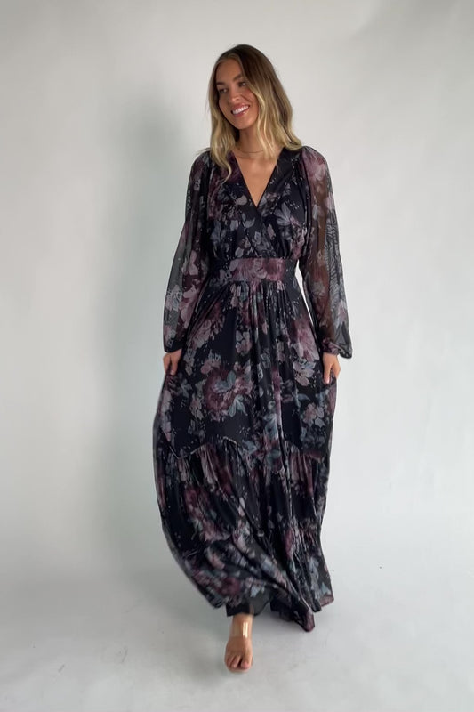 Midnight floral mesh maxi dress with sheer long sleeves, surplice V-neck, elastic waist with self-tie belt, tiered skirt, and keyhole back.