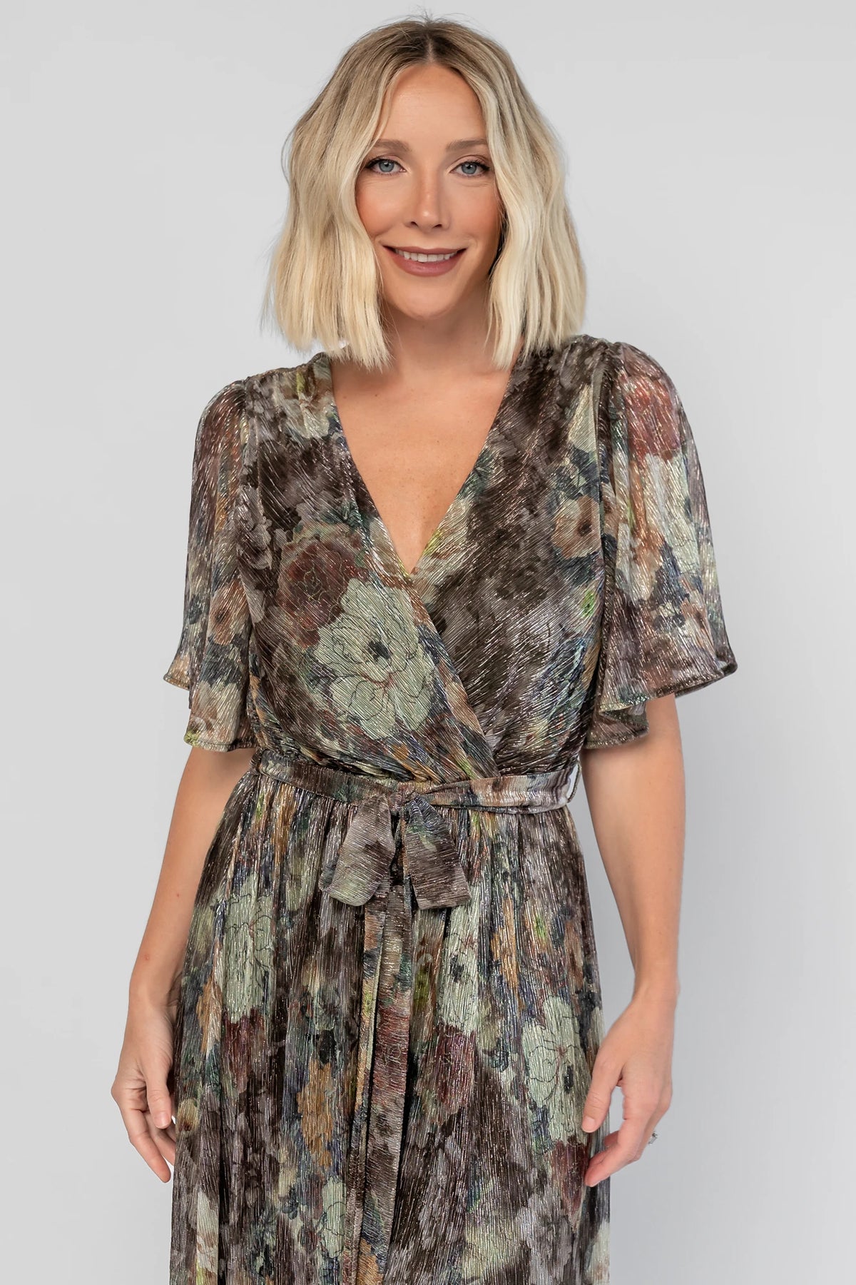 Rachel Maxi Dress in Green Multi with abstract floral details, a faux-wrap neckline, and semi-sheer overlay.