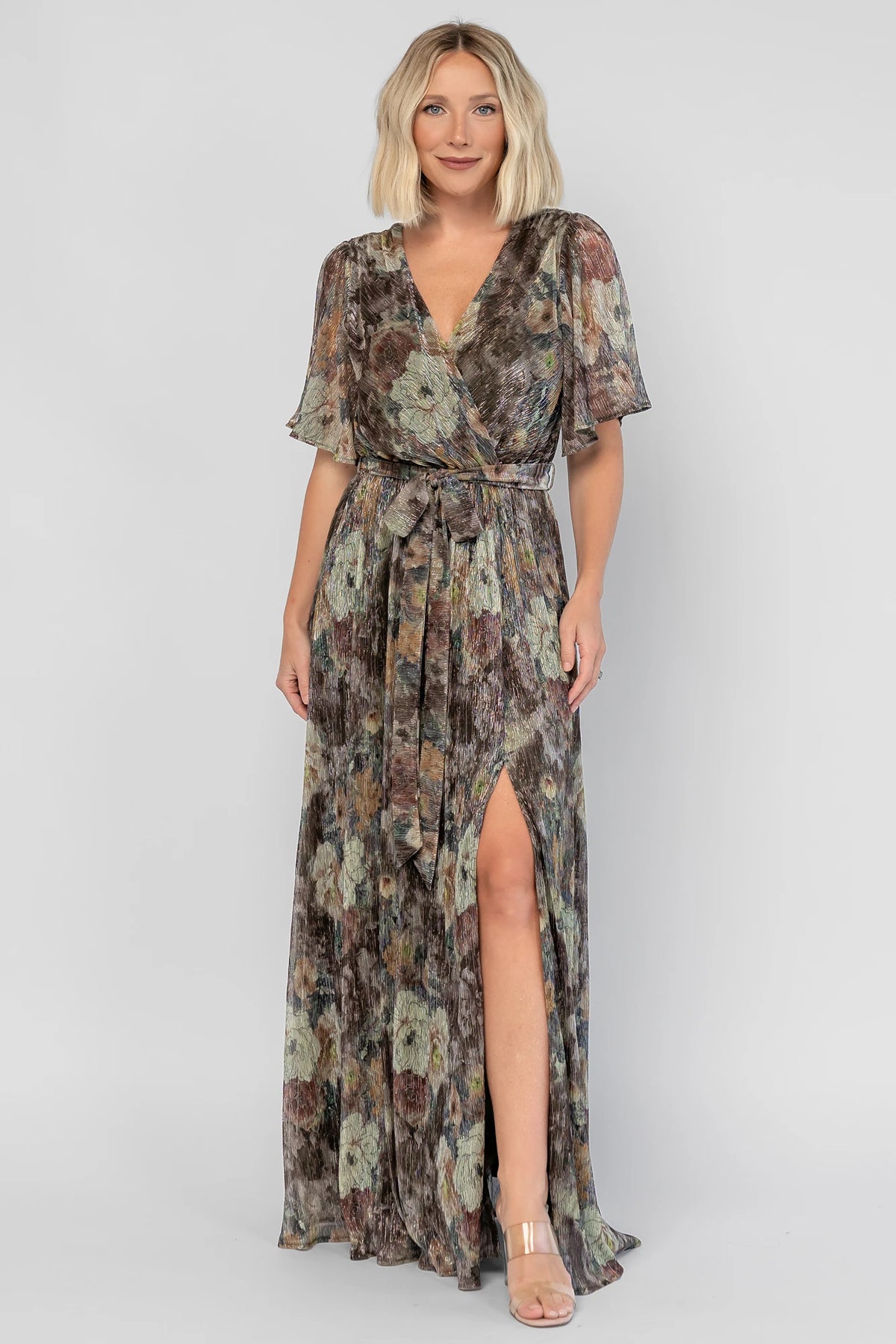 Rachel Maxi Dress in Green Multi with abstract floral details, a faux-wrap neckline, and semi-sheer overlay.